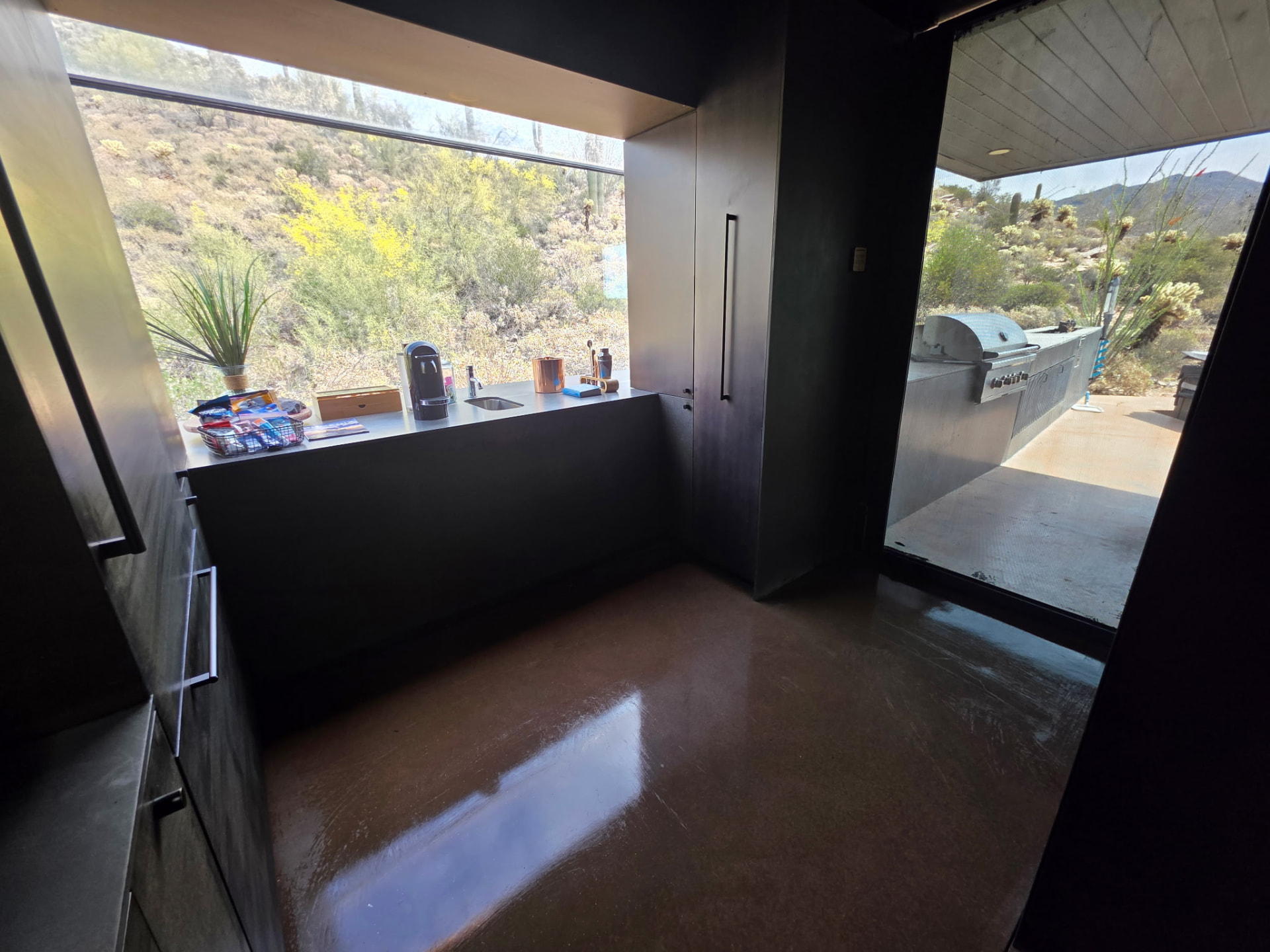 Same kitchenette with polished floors and clean surfaces after cleaning